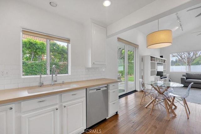 22724 Califa St, Woodland Hills, CA 91367 - kitchen with dishwasher, a sink, white cabinetry, tasteful backsplash, and light countertops