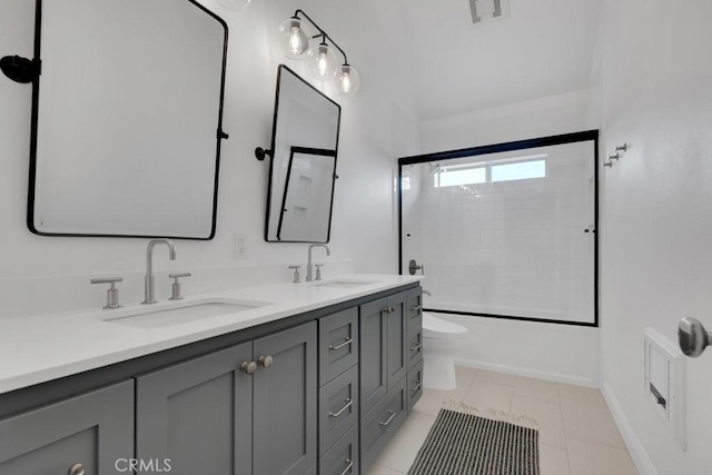 22724 Califa St, Woodland Hills, CA 91367 - full bath with toilet, double vanity, combined bath / shower with glass door, baseboards, and tile patterned flooring