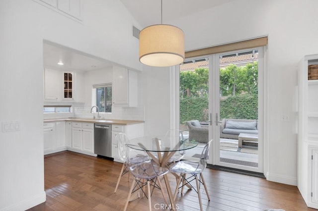 22724 Califa St, Woodland Hills, CA 91367 - dining space featuring dark wood finished floors, baseboards, and french doors