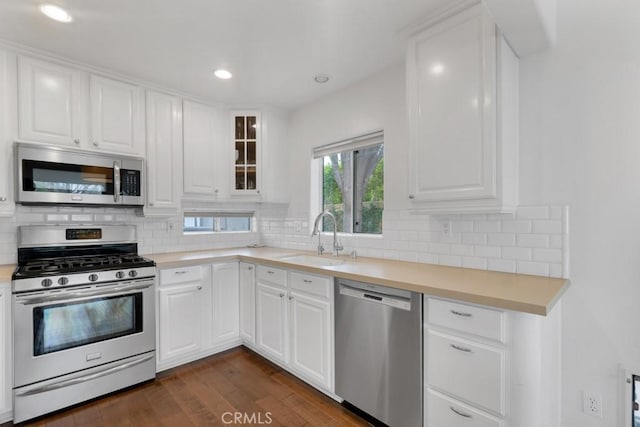 22724 Califa St, Woodland Hills, CA 91367 - kitchen with stainless steel appliances, a sink, dark wood finished floors, backsplash, and recessed lighting