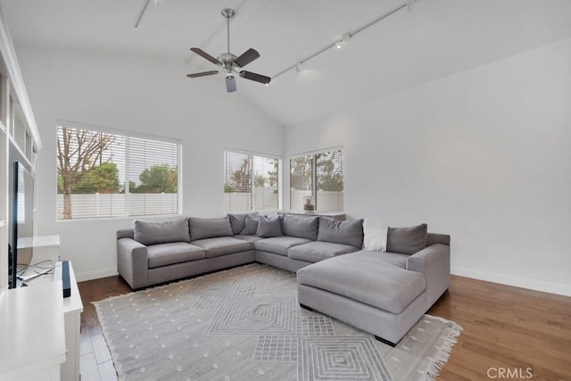 22724 Califa St, Woodland Hills, CA 91367 - living room featuring rail lighting, wood finished floors, a ceiling fan, baseboards, and high vaulted ceiling