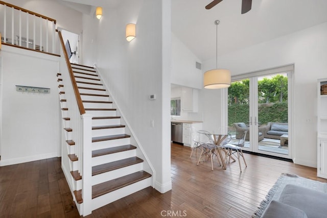 22724 Califa St, Woodland Hills, CA 91367 - staircase with high vaulted ceiling, a ceiling fan, french doors, wood finished floors, and baseboards