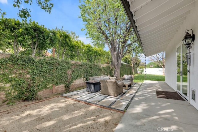 22724 Califa St, Woodland Hills, CA 91367 - fenced backyard featuring a patio and an outdoor living space with a fire pit