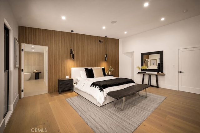 bedroom featuring visible vents, recessed lighting, and light wood-style floors