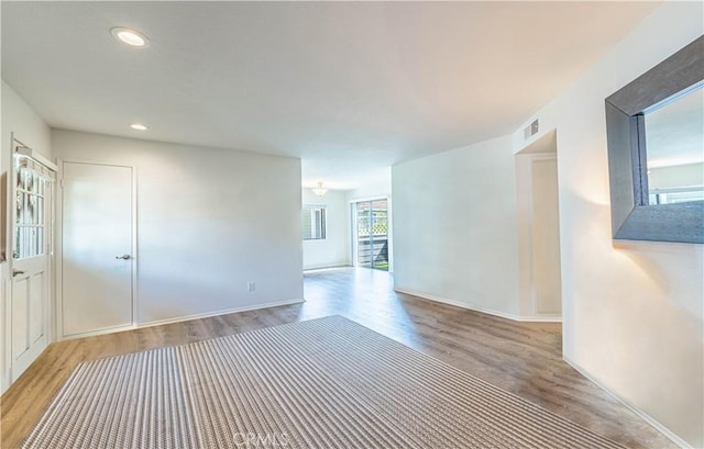 65 Rambling Ln, Aliso Viejo, CA 92656 - empty room with baseboards, recessed lighting, wood finished floors, and visible vents