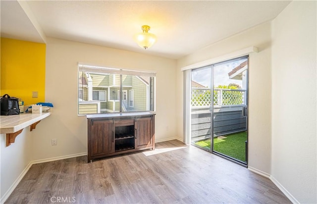 65 Rambling Ln, Aliso Viejo, CA 92656 - dining space with baseboards and wood finished floors