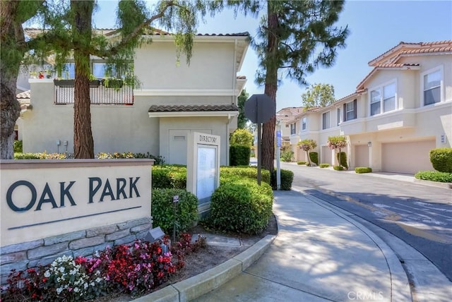 803 Maplewood, Irvine, CA 92618 - community sign featuring an attached garage, driveway, and a residential view