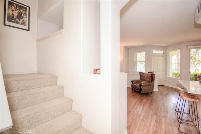 803 Maplewood, Irvine, CA 92618 - staircase with baseboards, a healthy amount of sunlight, and wood finished floors