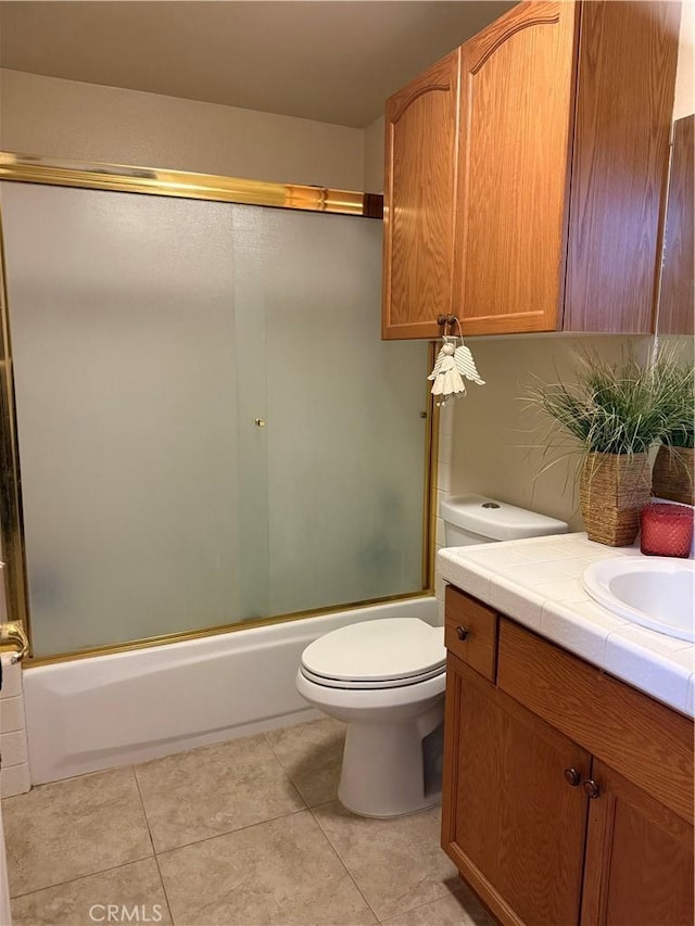 5170 Coronado St, Chowchilla, CA 93610 - bathroom with shower / bath combination with glass door, toilet, tile patterned flooring, and vanity