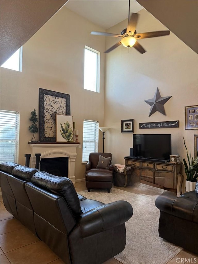 5170 Coronado St, Chowchilla, CA 93610 - tiled living room with a high ceiling, ceiling fan, and a fireplace