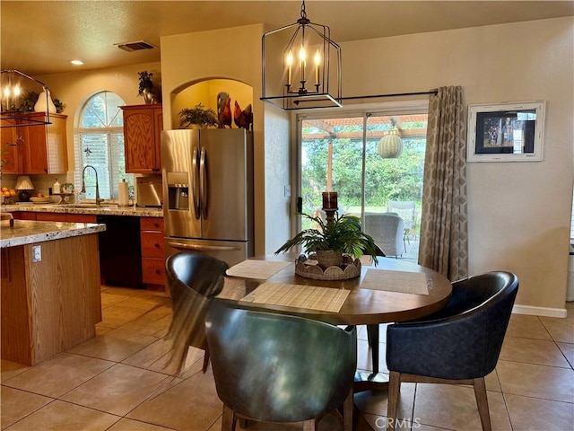 5170 Coronado St, Chowchilla, CA 93610 - dining space featuring light tile patterned floors, baseboards, visible vents, and a chandelier
