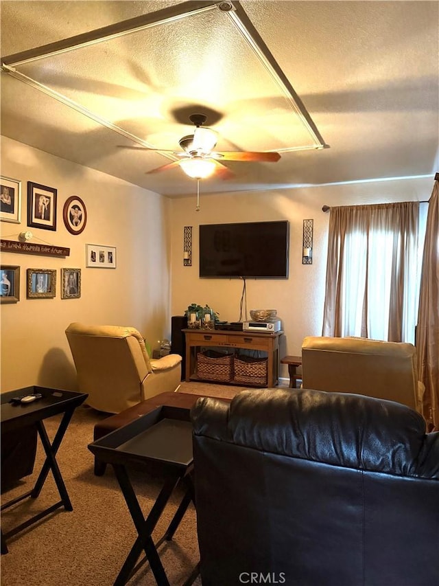 5170 Coronado St, Chowchilla, CA 93610 - carpeted living area featuring a ceiling fan and a textured ceiling