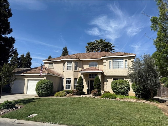5170 Coronado St, Chowchilla, CA 93610 - view of front of home with a front lawn, stucco siding, an attached garage, and a tile roof