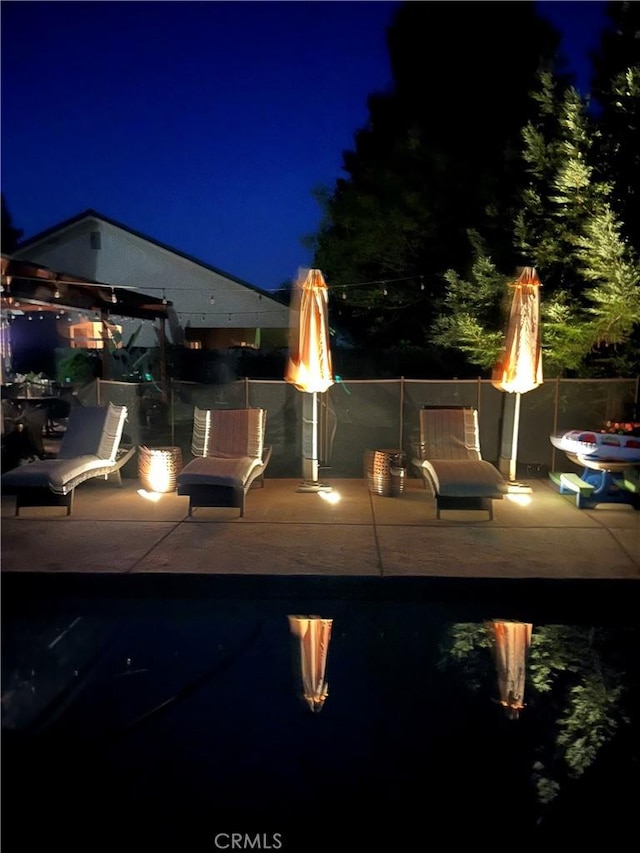 5170 Coronado St, Chowchilla, CA 93610 - patio at twilight featuring an outdoor fire pit