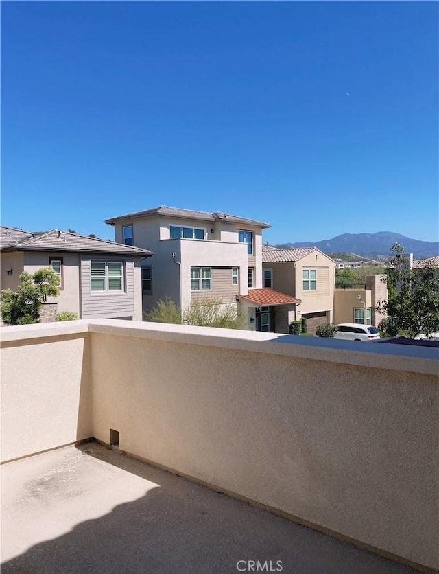 balcony with a mountain view and a residential view