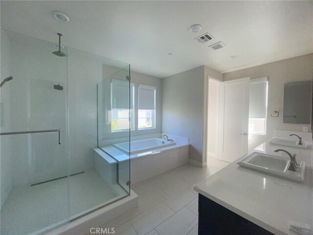 99 Swift, Irvine, CA 92618 - bathroom with a stall shower, a bath, double vanity, tile patterned floors, and baseboards