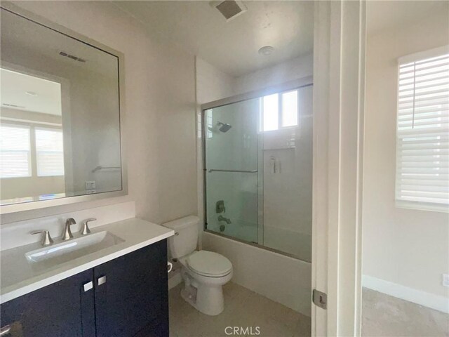 99 Swift, Irvine, CA 92618 - full bathroom with toilet, vanity, and shower / bath combination with glass door