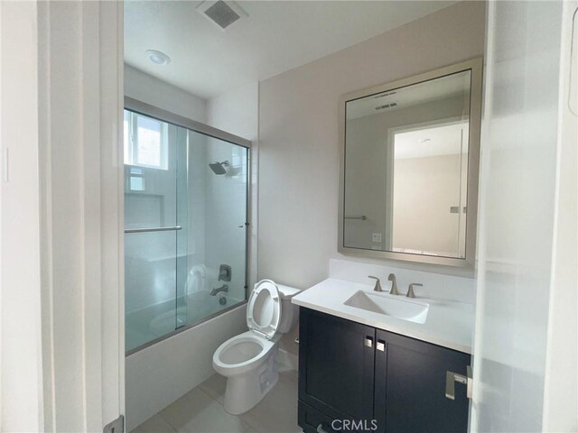 99 Swift, Irvine, CA 92618 - bathroom with vanity, combined bath / shower with glass door, toilet, and tile patterned flooring