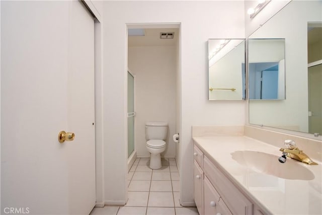 full bathroom with toilet, visible vents, a shower with door, tile patterned flooring, and vanity