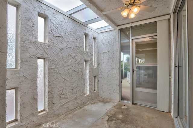 exterior space featuring a ceiling fan