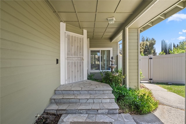 doorway to property with fence
