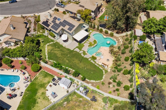 aerial perspective of suburban area featuring a pool