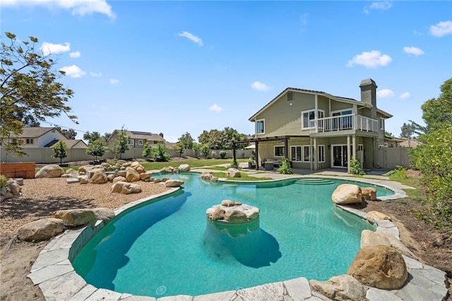 view of swimming pool featuring a fenced backyard and a patio