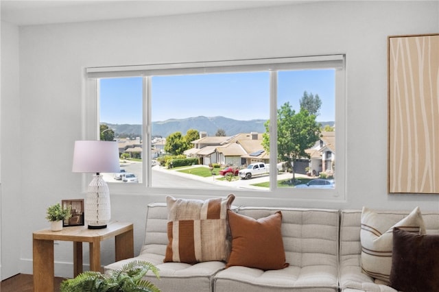 living area featuring a mountain view and healthy amount of natural light