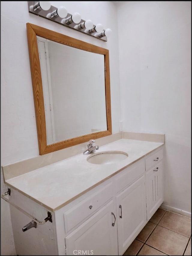 bathroom with tile patterned floors and vanity