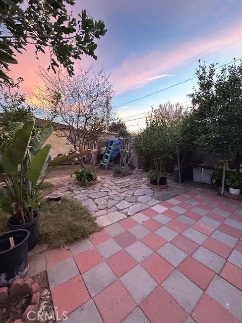 7935 Cleon Ave, Sun Valley, CA 91352 - patio terrace at dusk with fence
