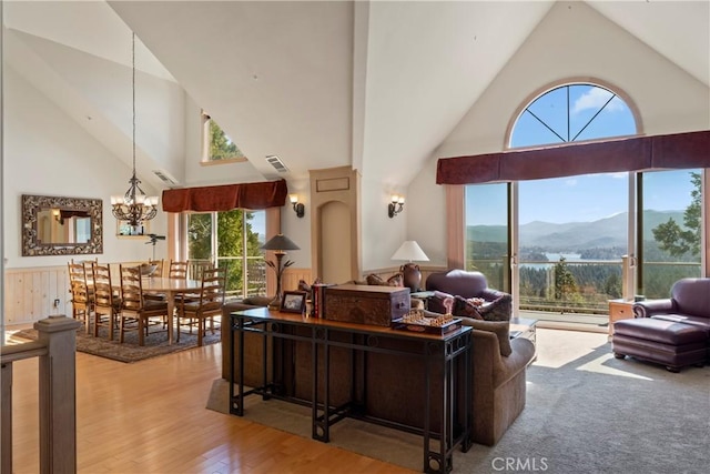 432 Grizzly Rd, Lake Arrowhead, CA 92352 - living area with a mountain view, high vaulted ceiling, a chandelier, and wood finished floors