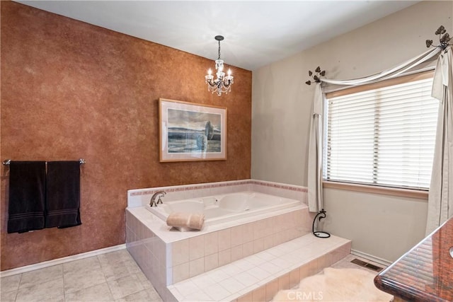 bathroom with tile patterned floors, visible vents, baseboards, a notable chandelier, and a garden tub