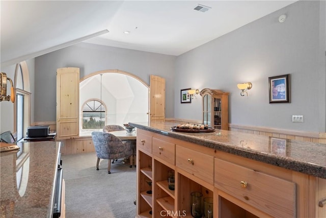 bathroom with visible vents and lofted ceiling