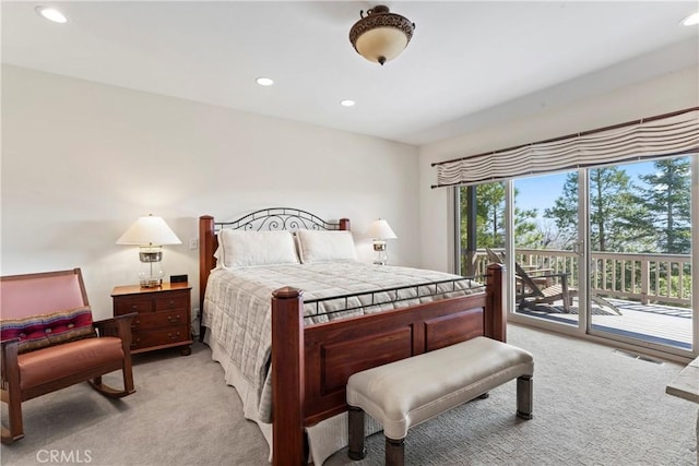 bedroom with visible vents, recessed lighting, access to exterior, and light carpet