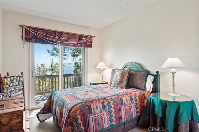 carpeted bedroom with access to outside