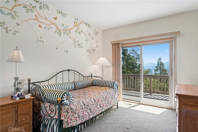 carpeted bedroom with access to exterior