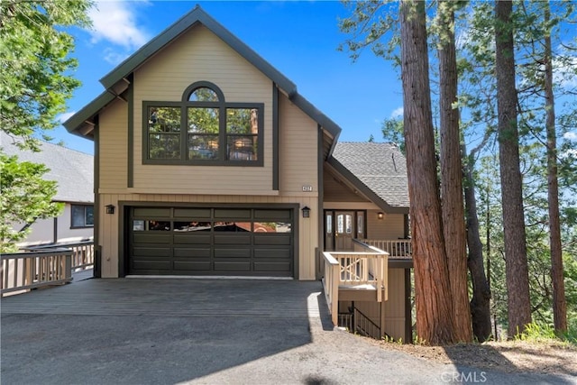 432 Grizzly Rd, Lake Arrowhead, CA 92352 - view of front facade featuring an attached garage, driveway, and a shingled roof