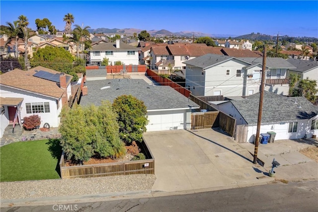 aerial view featuring a mountain view and a residential view