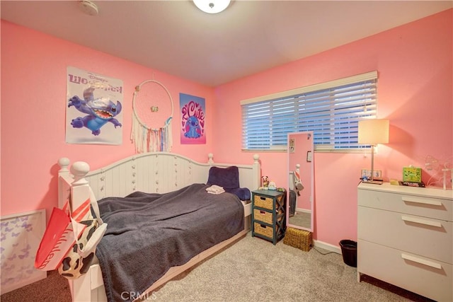 carpeted bedroom with baseboards