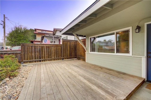 wooden terrace featuring fence