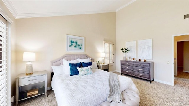 carpeted bedroom with a high ceiling, baseboards, crown molding, and visible vents