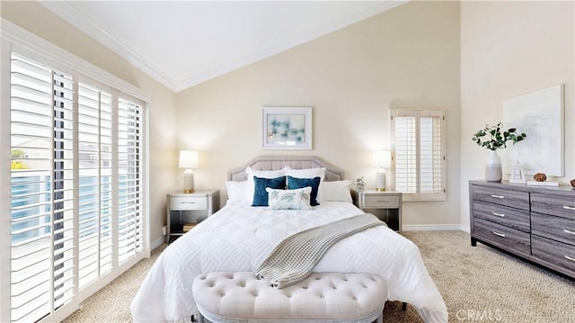 carpeted bedroom featuring vaulted ceiling, crown molding, and baseboards