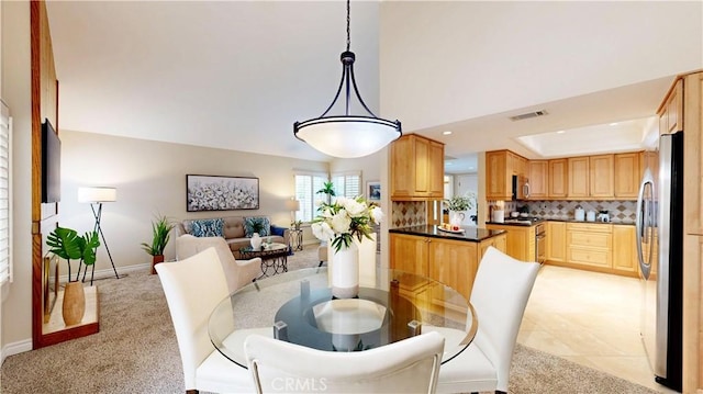 dining area featuring recessed lighting, visible vents, baseboards, and light colored carpet