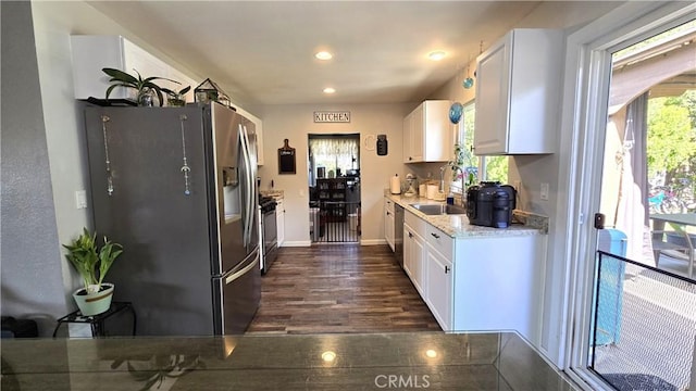 1954 Elizabeth Ave, Corning, CA 96021 - kitchen with a sink, baseboards, recessed lighting, white cabinetry, and appliances with stainless steel finishes