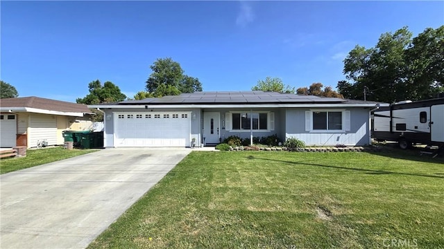 1954 Elizabeth Ave, Corning, CA 96021 - ranch-style home featuring a garage, solar panels, a front yard, and concrete driveway
