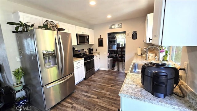 1954 Elizabeth Ave, Corning, CA 96021 - kitchen with white cabinets, stainless steel appliances, dark wood-style floors, and recessed lighting