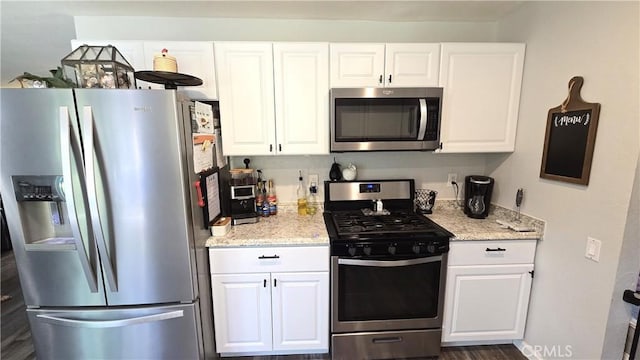 1954 Elizabeth Ave, Corning, CA 96021 - kitchen with white cabinets, light stone countertops, and stainless steel appliances