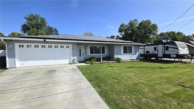 1954 Elizabeth Ave, Corning, CA 96021 - single story home with a garage, driveway, a front yard, and solar panels