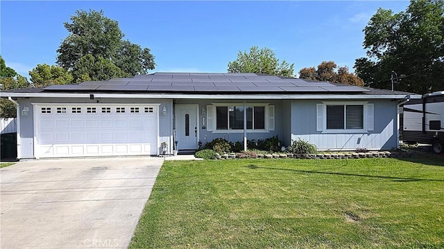 1954 Elizabeth Ave, Corning, CA 96021 - single story home featuring a front lawn, driveway, roof mounted solar panels, and a garage