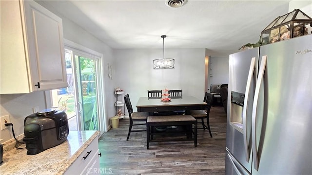 1954 Elizabeth Ave, Corning, CA 96021 - dining room with visible vents, a chandelier, and dark wood-style flooring